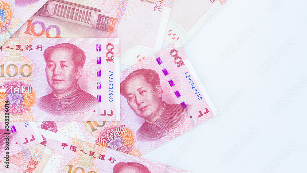 Fotografija Chinese paper currency Yuan renminbi bill banknotes on white background, Banknote one hundred yuan, More chinese yuan background, China or economy of Asia growth, US trade war concept