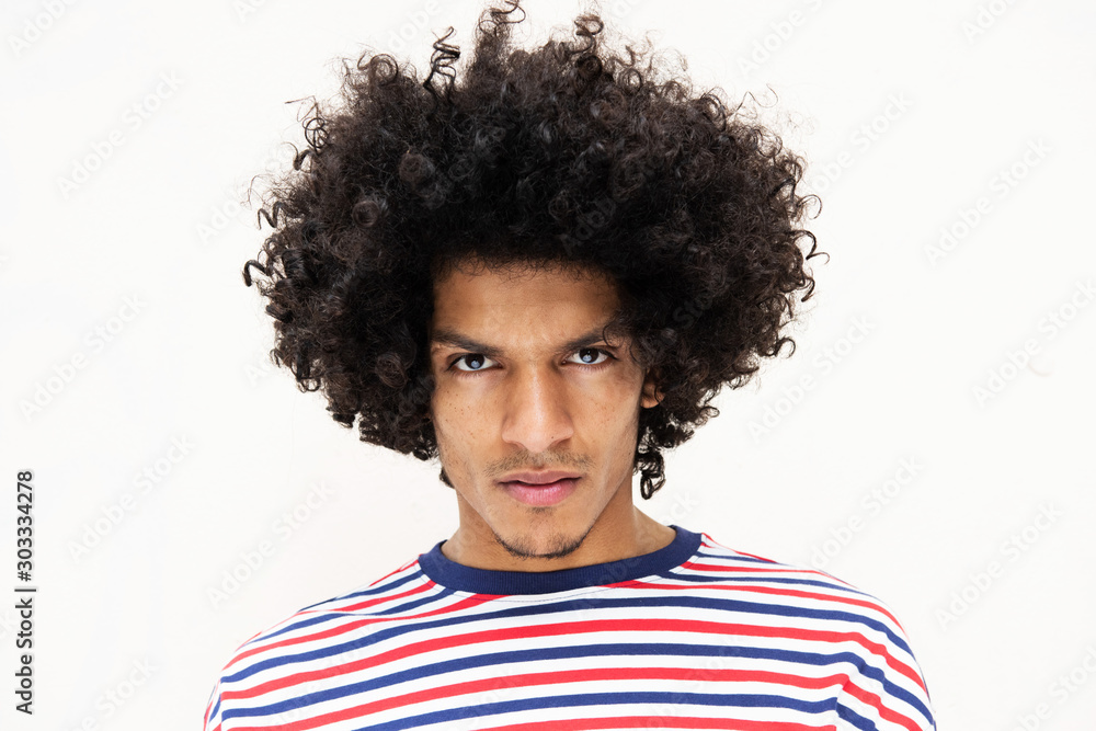 Close up front portrait handsome young North African man with afro hairstyle  and serious face expression by isolated white background Stock Photo |  Adobe Stock