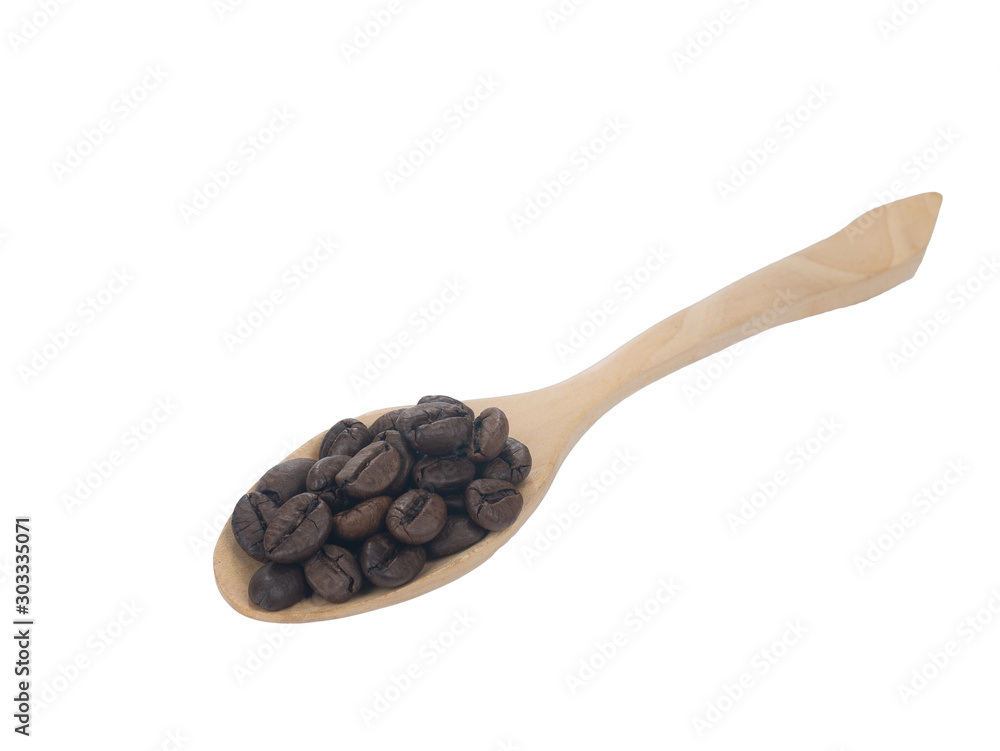 Pile Roasted brown coffee beans on woods spoon isolated on white background.close up Pile Roasted brown coffee beans on woods spoon isolated on white background.close up