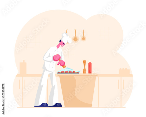 Concentrated Man Chef in White Uniform and Toque Cooking Pepper Fish Lying on Tray with Veggies