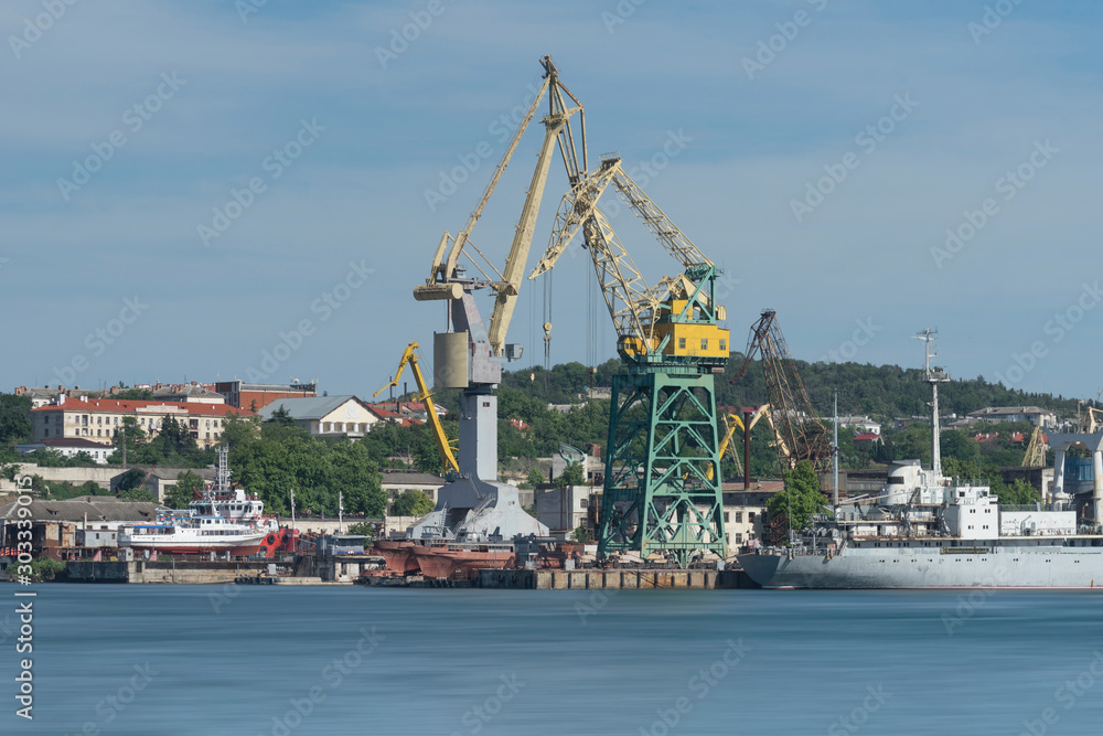 Industrial landscape with cranes in the seaport of Sevastopol