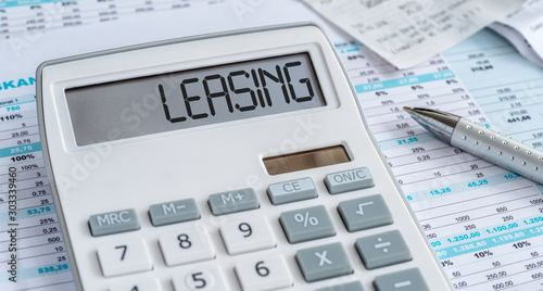A calculator with the word Leasing on the display photo
