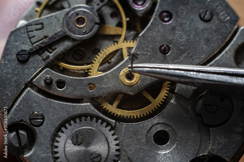 Watchmaker is repairing the wristwatch, mechanical watch