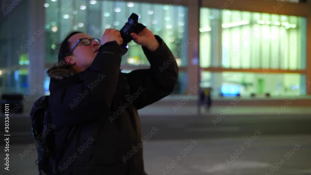 Photographer at night taking photo of tall downtown office buildings 3 Photographer at night taking photo of tall downtown office buildings 3