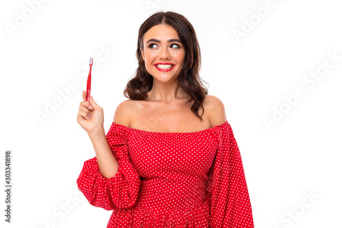 Beautiful young woman with perfect smile and tooth brush advises regulary brush teeth, picture isolated on white background photo