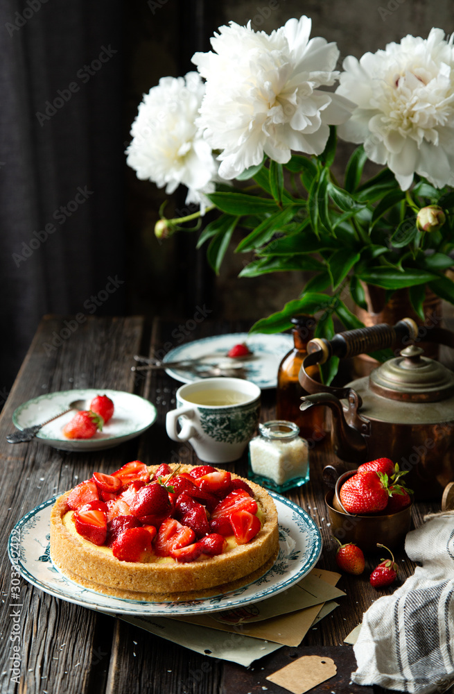 Homemade delicious strawberry tart or pie with sweet glazed berries on top Homemade delicious strawberry tart or pie with sweet glazed berries on top