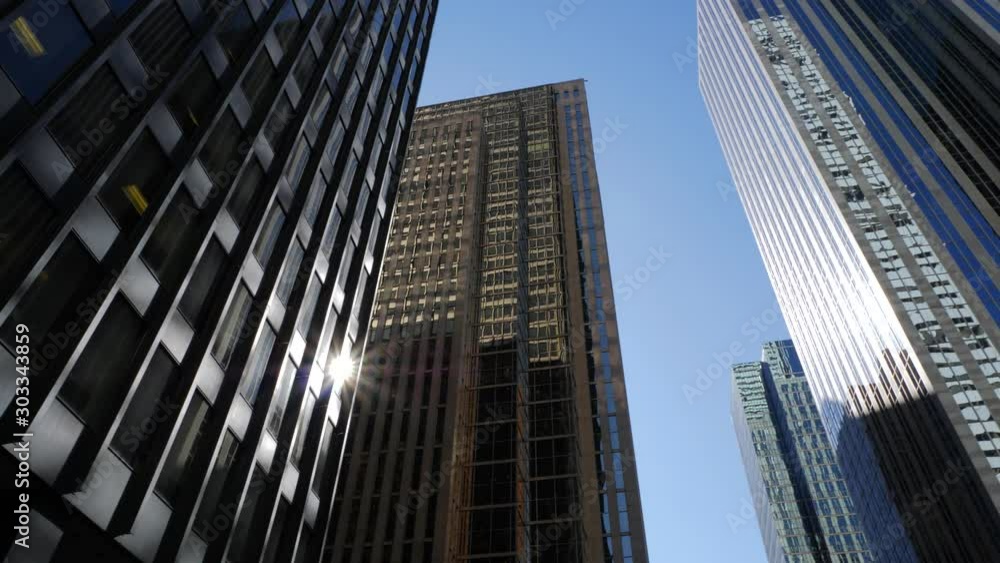 Tilting up to reveal tall downtown office buildings on sunny day 1 Tilting up to reveal tall downtown office buildings on sunny day 1