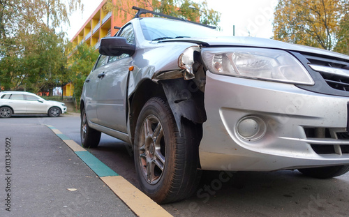 Broken passenger car close-up. Accident, car repair. © Aleksandr