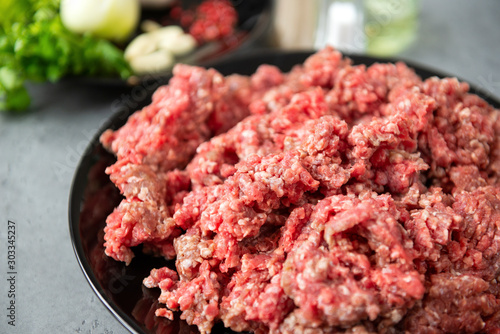 minced pork meat on a plate, raw meat,