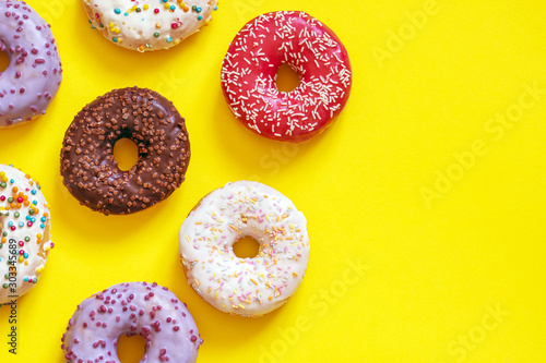 assorted donuts on a yellow background