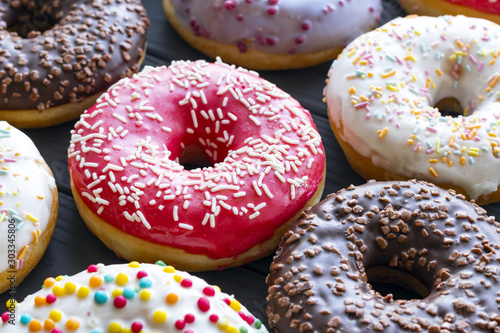 assorted donuts with chocolate frosted closeup