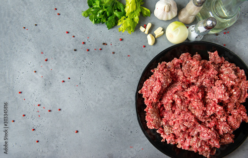 plate of fresh minced pork meat, spices, garlic, celery, onion, pepper