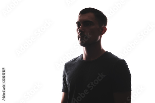 Silhouette portrait of man on the side looking straight isolated on white background