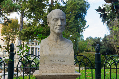 Old marble bust of Archimedes of Syracuse in the public park Pincian Hill, Villa Borghese gardens, Rome, Italy