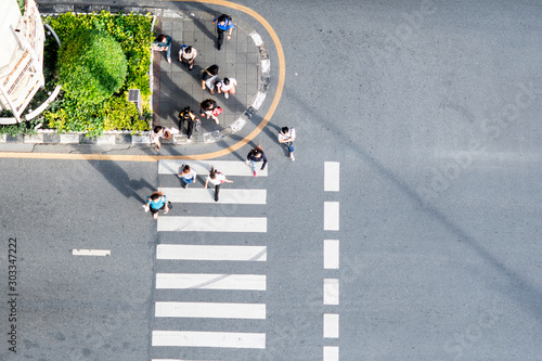 Photography top view of crowd people walk on pedestrian crosswalk street pavement