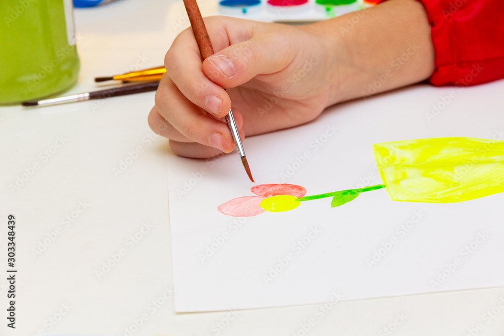 girl is drawing at the table girl is drawing at the table