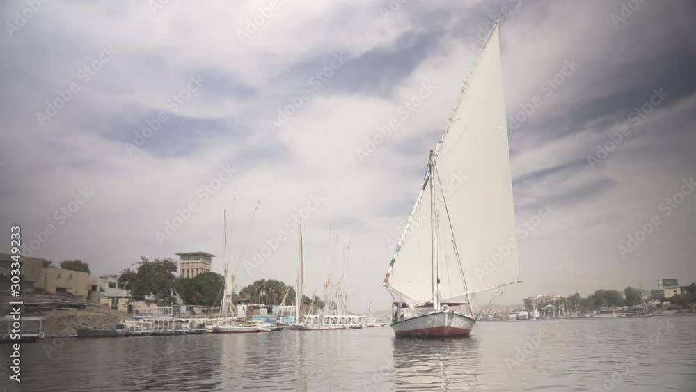 Bow of Felucca Sailboat Sailing on Low Breeze. Bow of Felucca Sailboat Sailing on Low Breeze.
