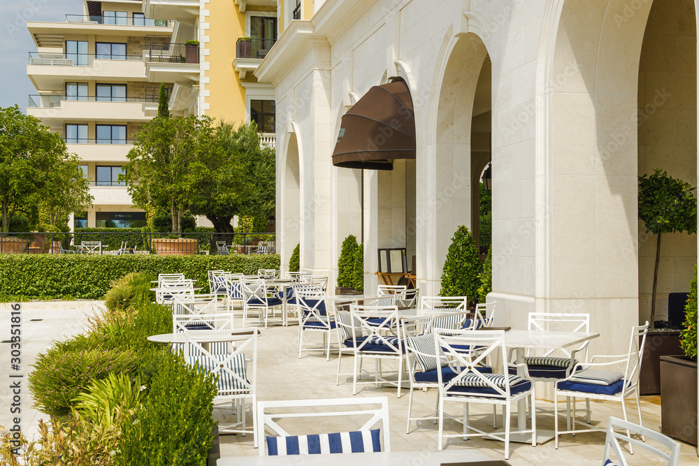 Φωτογραφία Cozy and beautiful street cafe on the sea promenade in Tivat, Montenegro