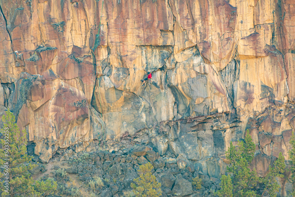 Climber on overhanging cliff route, Smith Rock State Park