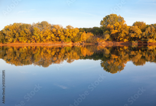 autumnal scenery with lake and colorful trees