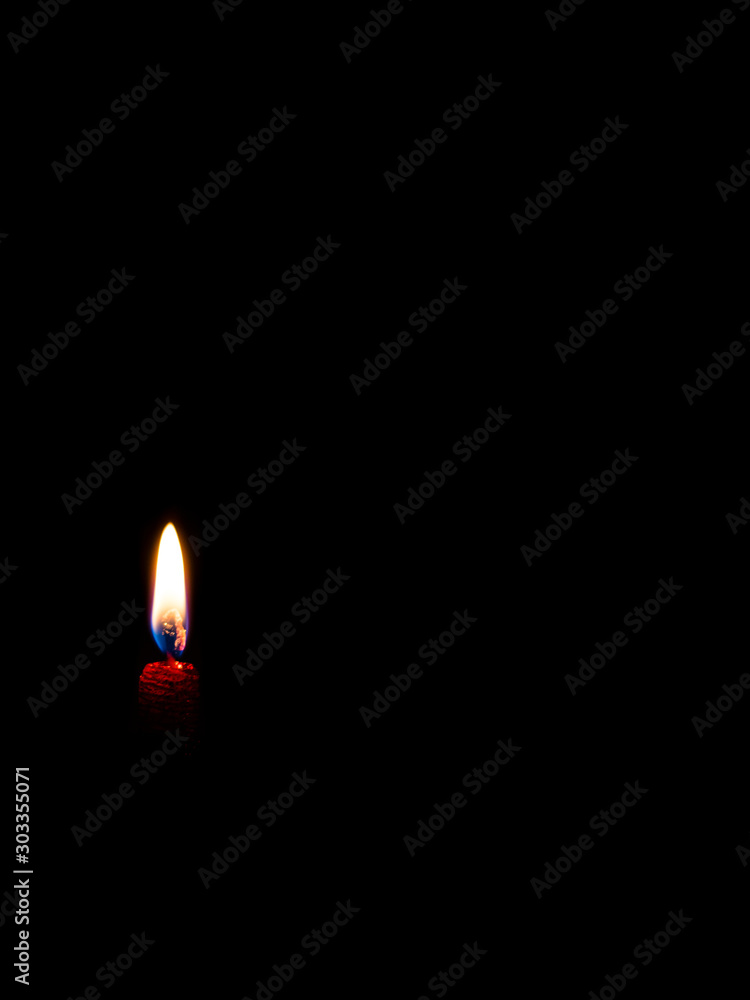 Flame from burning candle. Light from little source. Christmas burning candle. Flame from burning candle. Light from little source. Christmas burning candle.