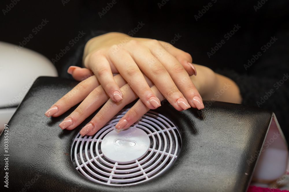 Women hands crossed in nail salon