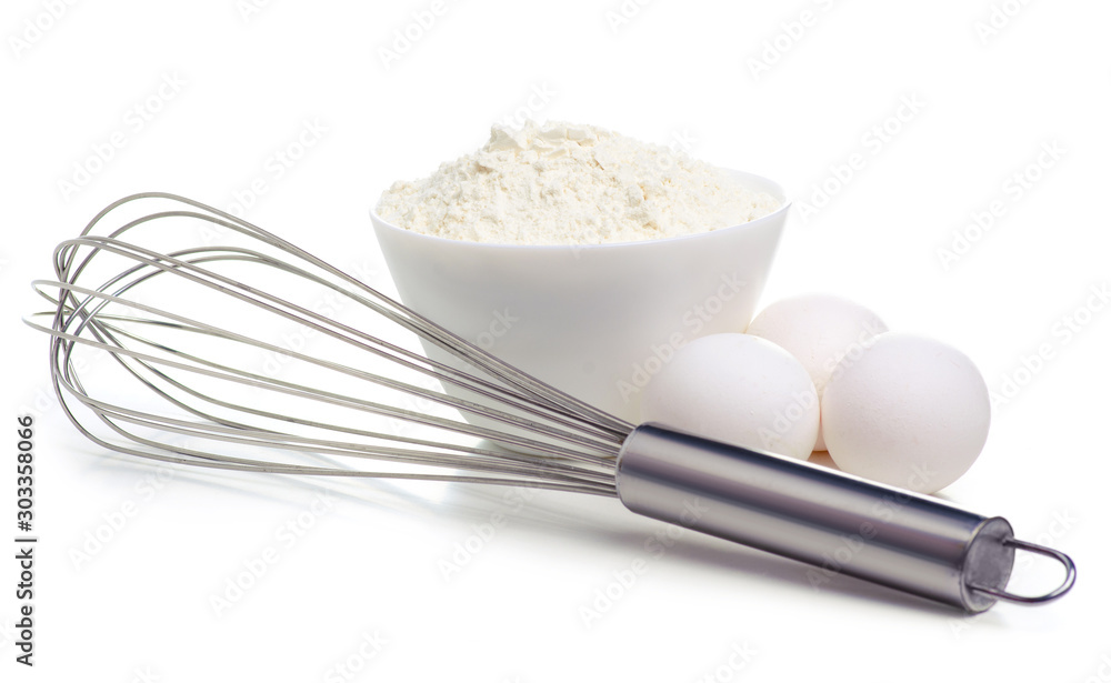 White bowl with flour and eggs, whisk on white background isolation White bowl with flour and eggs, whisk on white background isolation