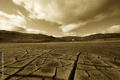 Dried land in the desert. Cracked soil crust