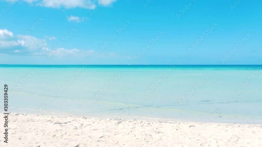 Beautiful Caribbean Beach With Shallow Ocean Water On A Sunny Afternoon Beautiful Caribbean Beach With Shallow Ocean Water On A Sunny Afternoon