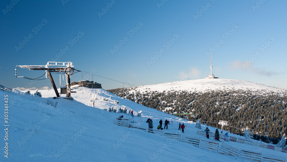 Winter trail in Jeseniky mountains in zhe Czechia during nice winter day  with clear sky. Wiew