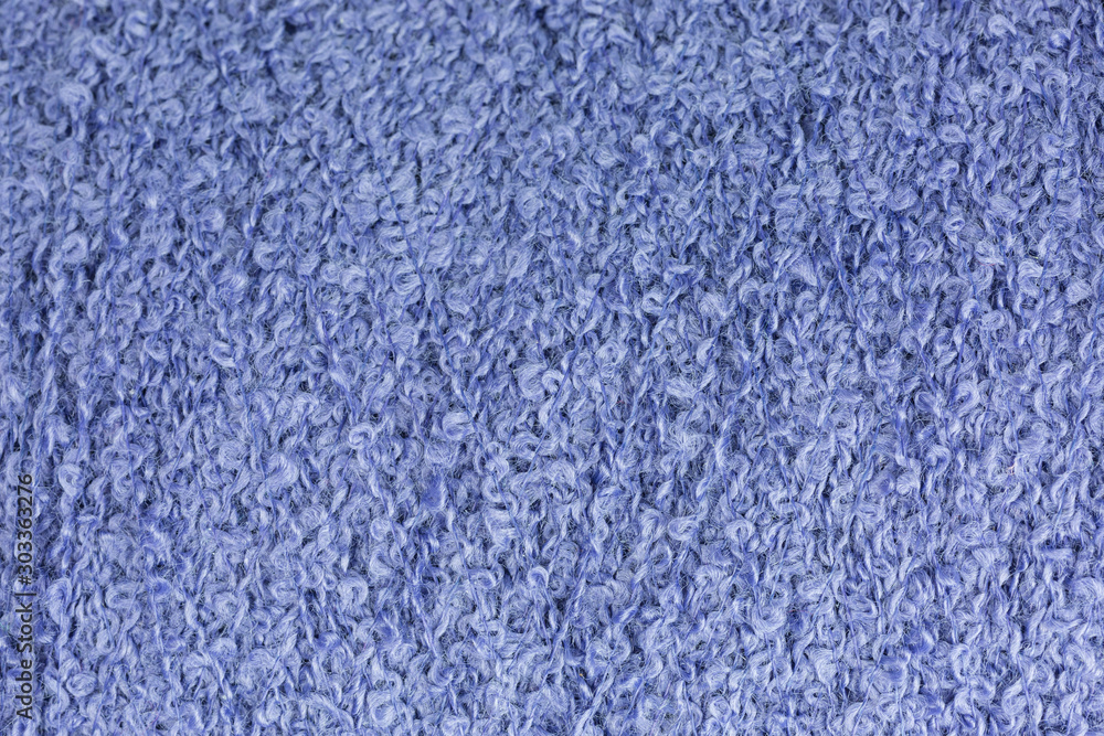 background of lilac bouclé yarn on a cone background of lilac bouclé yarn on a cone