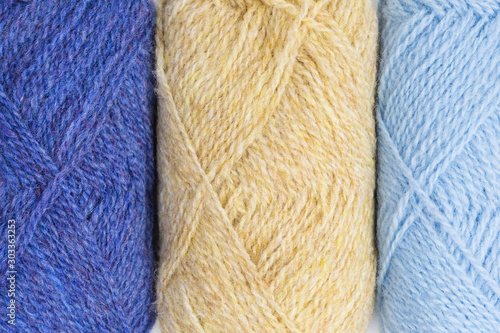 background of balls of shetland wool in blue and beige