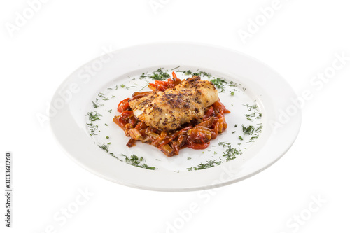 Pork Loin steak with honey mustard sauce and zucchini and eggplant stew isolated on white background