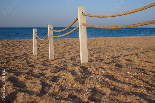 wooden fence on the beach