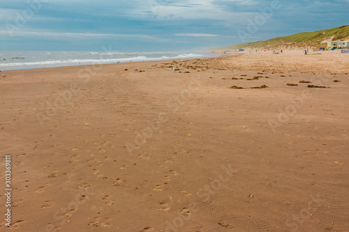 footprints in the sand at wijk aan zee