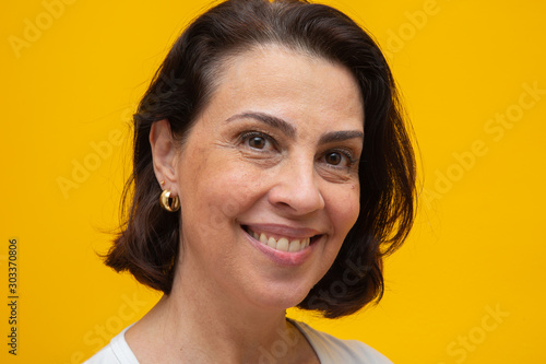 Close up portrait of a beautiful mid adult woman smiling photo
