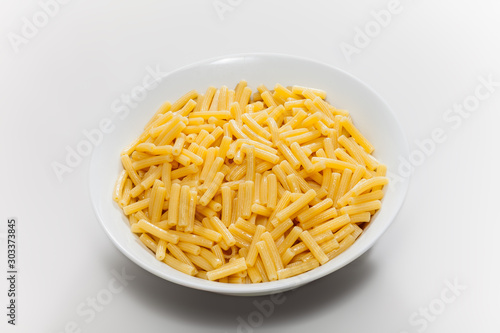isolated pasta in plate on white background