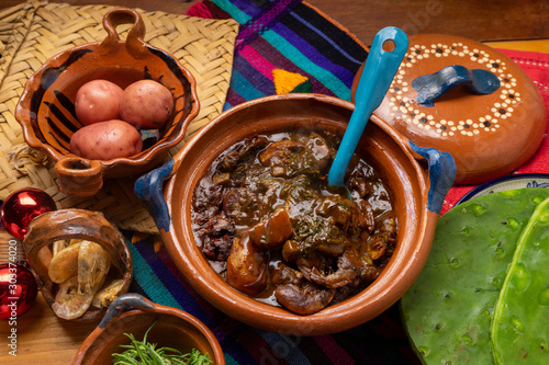 Mexican rosemary with mole sauce and dried shrimps also called 