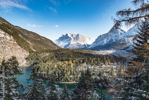 Austria Zugspitze mountain panorama with lake and snow in mountains