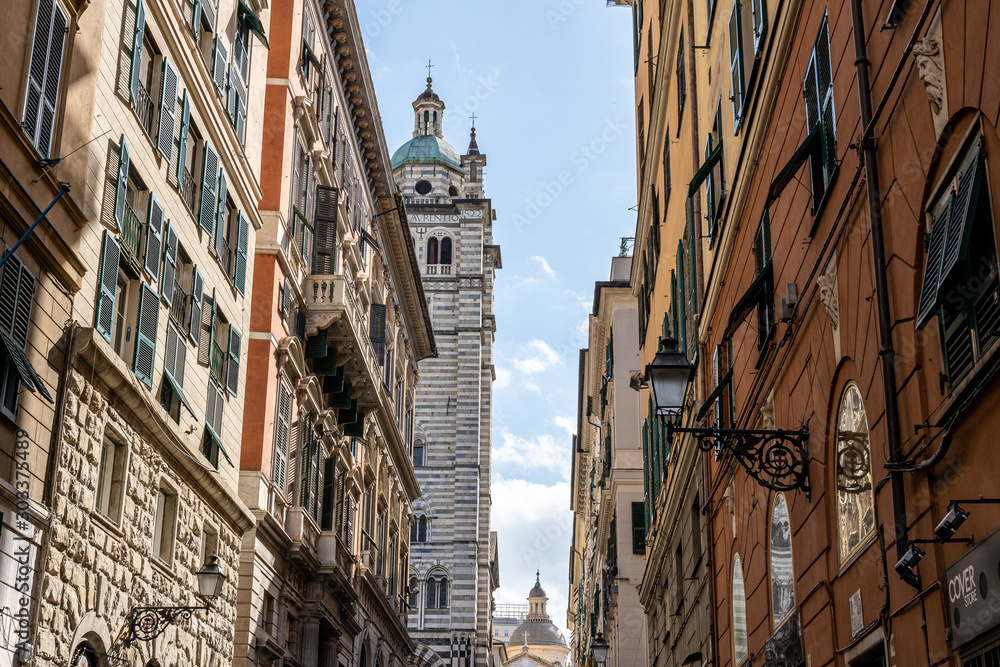 old church tower photographed in the streets of genua, italy