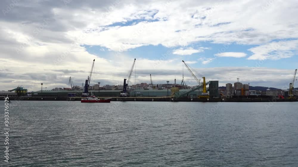 The ship against the background of port. Port in the city La Coruña, Spain. The ship against the background of port. Port in the city La Coruña, Spain.