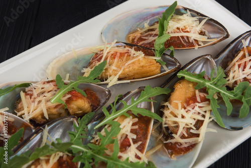 Cooked mussels with sauce c...