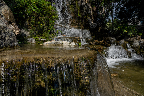 long exposure image of a waterfall in public parc in genua, italy