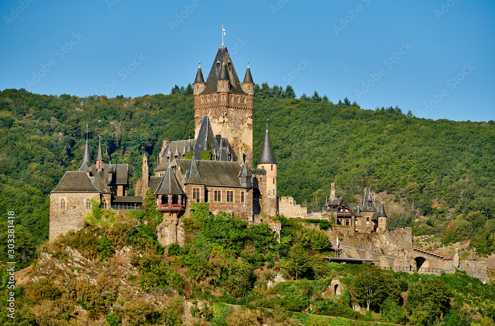 Beautiful Reichsburg castle on a hill in Cochem town, Germany