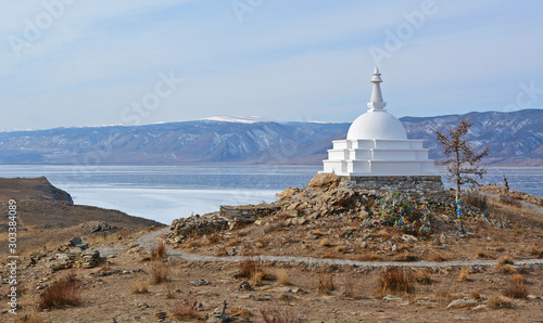 The Buddhist Stupa of Enlightenment in winter in sunny day at Ogoy Island, Baikal Lake , Russia