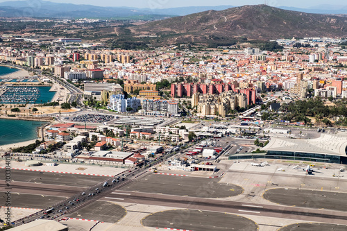 Gibraltar airport runway and La Linea de la Concepcion in Spain. View from the top of the rock of Gibraltar.
