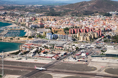 Gibraltar airport runway and La Linea de la Concepcion in Spain. View from the top of the rock of Gibraltar.