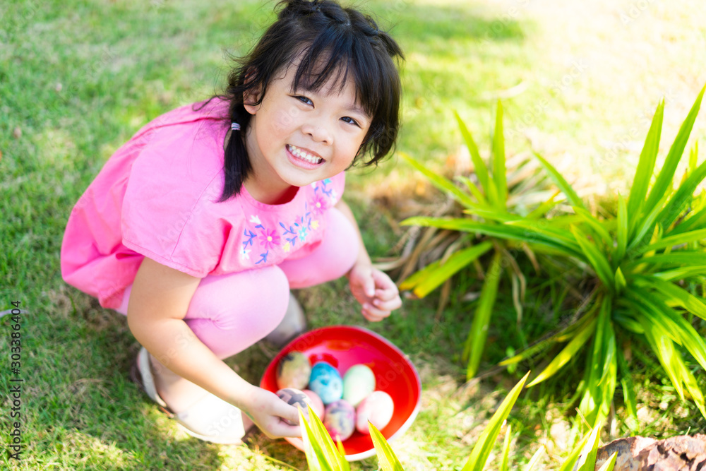 Ταπετσαρία Cute little asian child girl hunt easter egg on Sunday morning at Church in Easter day
