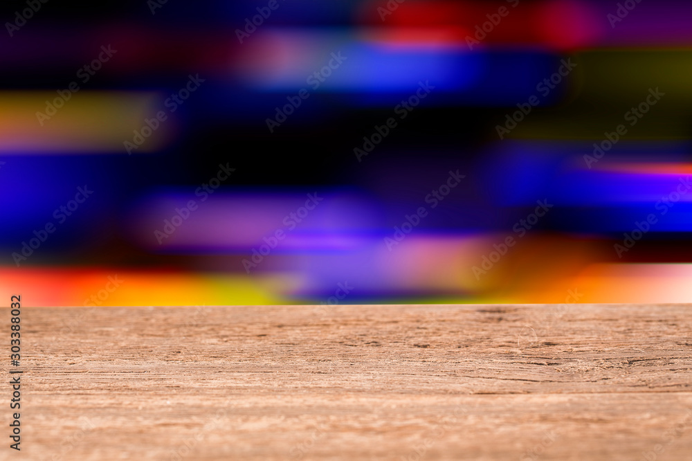 Fotografie Wood table top on blur and motion light background