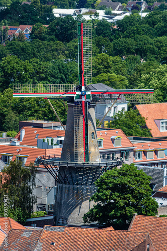 Windmill in Zierikzee, Netherlands between houses at summer